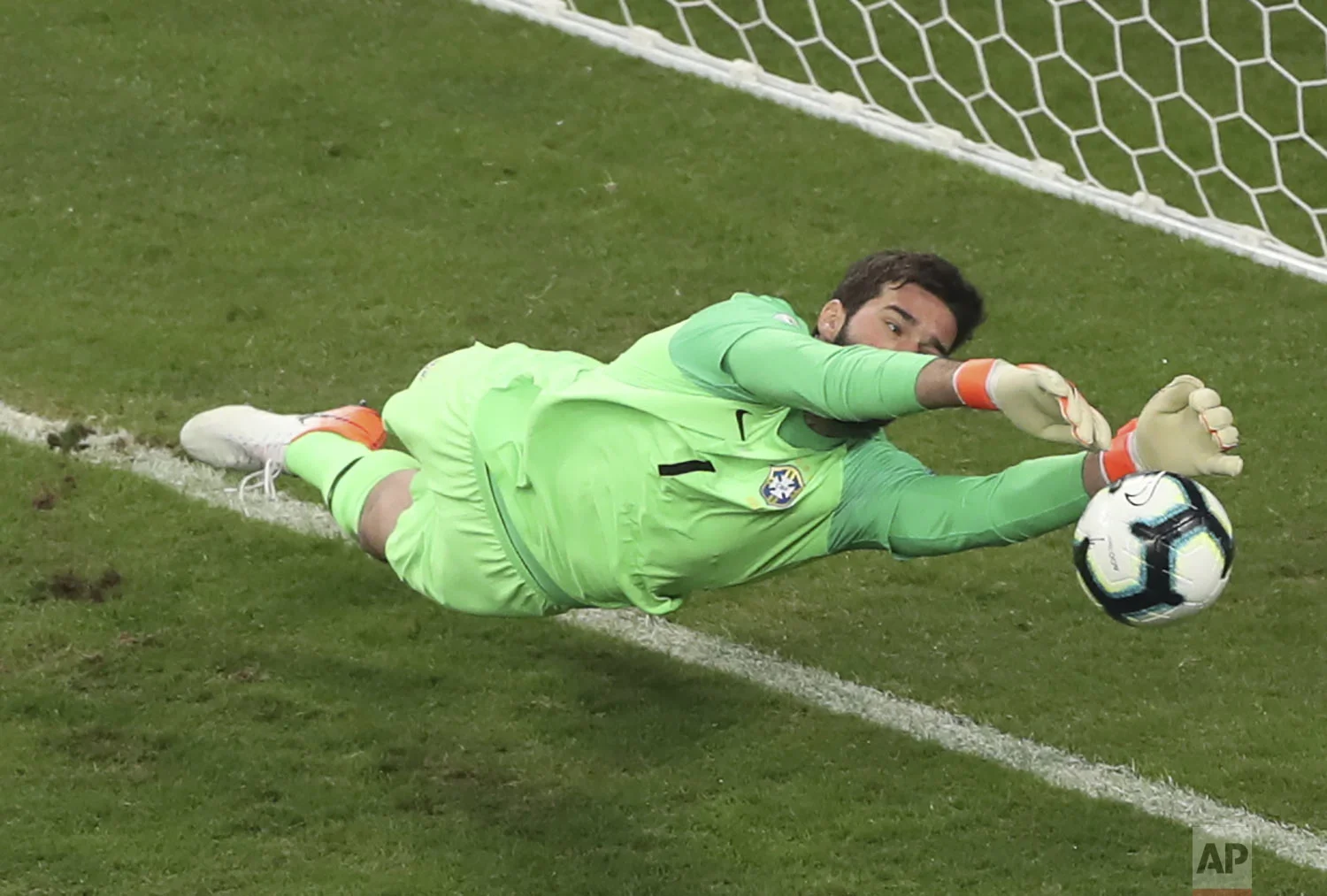 Brazil's goalkeeper Alison blocks the penalty kick by Paraguay's Gustavo Gomez during a Copa America quarterfinal soccer match at the Arena do Gremio in Porto Alegre, Brazil, Thursday, June 27, 2019. Brazil won the Copa America. (AP Photo/Ricardo Mazalan)