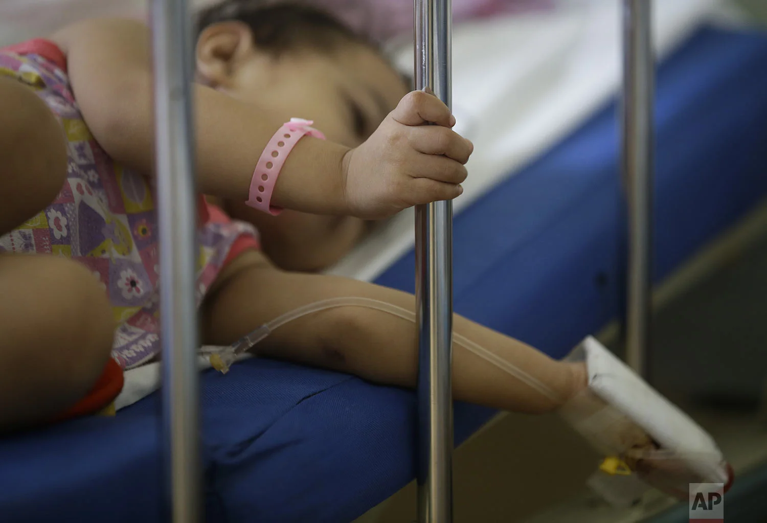 A young dengue patient rests inside a room at the San Lazaro government hospital in Manila, Philippines on Wednesday, Aug. 7, 2019. (AP Photo/Aaron Favila)