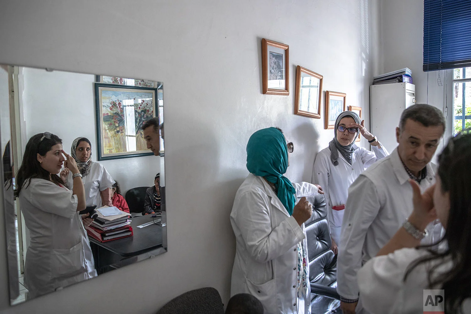 Dermatologists gather information on children affected by a rare disorder called xeroderma pigmentosum, or XP, inside a hospital in Casablanca, Morocco, July 24, 2019. (AP Photo/Mosa'ab Elshamy)