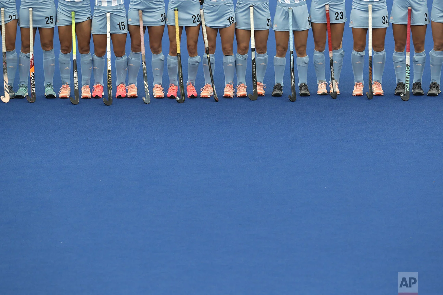 Argentina's hockey players stand in line during the playing of national anthems before their women's preliminaries pool WA against Canada at the Pan American Games in Lima, Peru, Wednesday, July 31, 2019. Argentina won 3-0. (AP Photo/Silvia Izquierdo)
