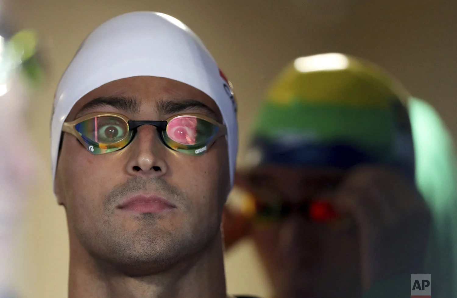 Dylan Carter of Trinidad and Tobago looks into the camera as he stands ready to compete in the men's swimming 200m freestyle final at the Pan American Games in Lima, Peru, Wednesday, Aug. 7, 2019. (AP Photo/Fernando Vergara)