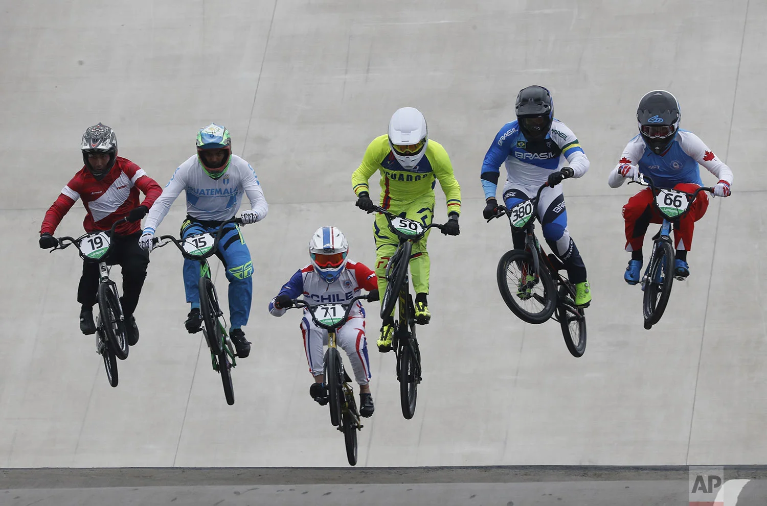 Athletes compete in men's cycling bmx semi-final at the Pan American Games in Lima, Peru, Friday, Aug. 9, 2019. (AP Photo/Fernando Llano)