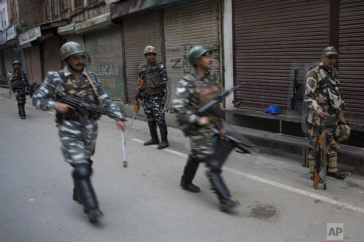 Indian Paramilitary soldiers patrol during curfew in Srinagar, Indian controlled Kashmir, Friday, Aug. 9, 2019. (AP Photo/ Dar Yasin)