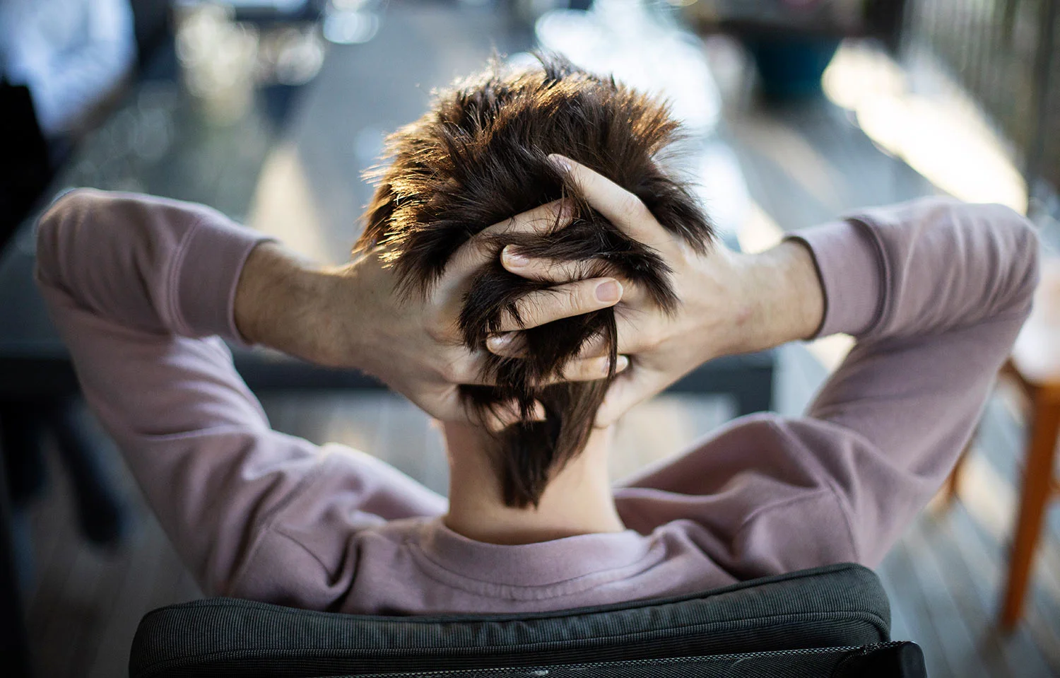 Sam Ware runs his fingers through his hair while listening to his mother urge him to go to rehab, in Fountaindale, Central Coast, Australia, Friday, July 19, 2019. (AP Photo/David Goldman)