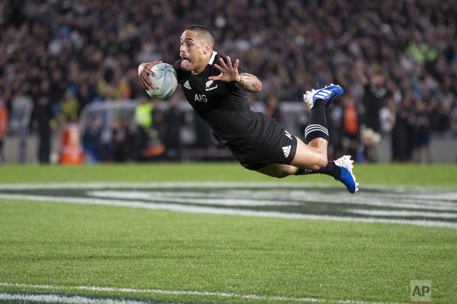  All Blacks halfback Aaron Smith dives over to score against Australia during their Bledisloe Cup rugby test match at Eden Park in Auckland, New Zealand, Saturday, Aug. 17, 2019. (Brett Phibbs/SNPA via AP) 
