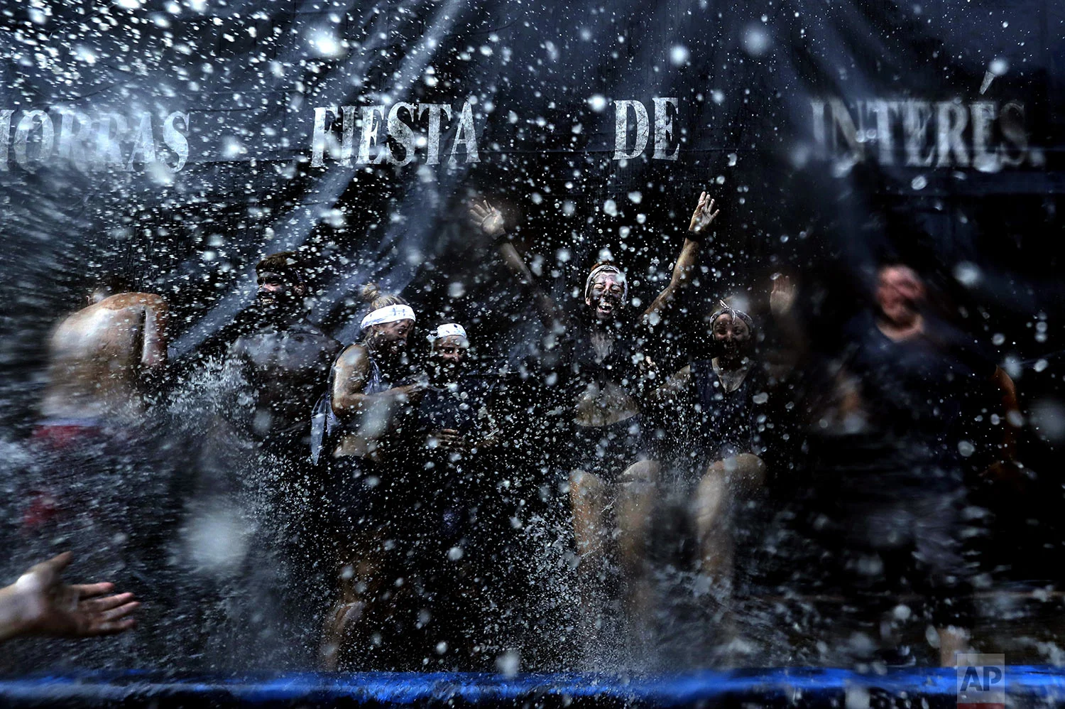 People painted with black grease celebrate during the traditional festivities of the Cascamorras festival in Baza, Spain, Friday, Sept. 6, 2019. (AP Photo/Manu Fernandez)