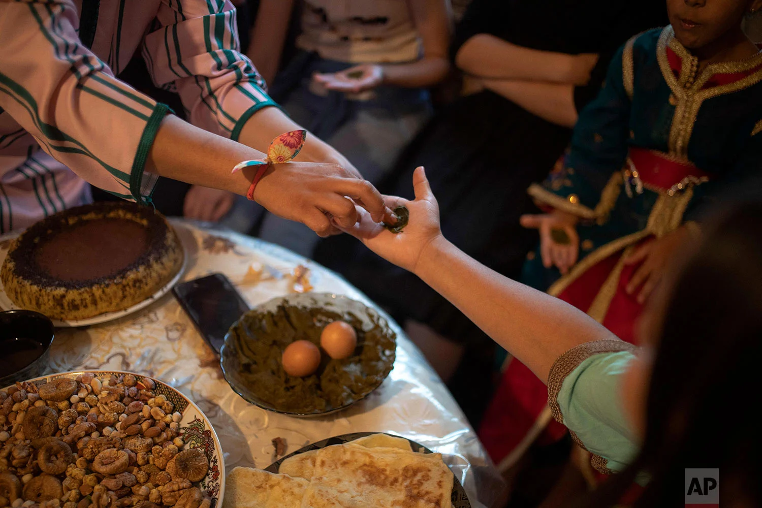 A young girl gets a henna tattoo to celebrate the occasion of Ashura, in Sale, near Rabat, Morocco, Sept. 10, 2019. (AP Photo/Mosa'ab Elshamy)