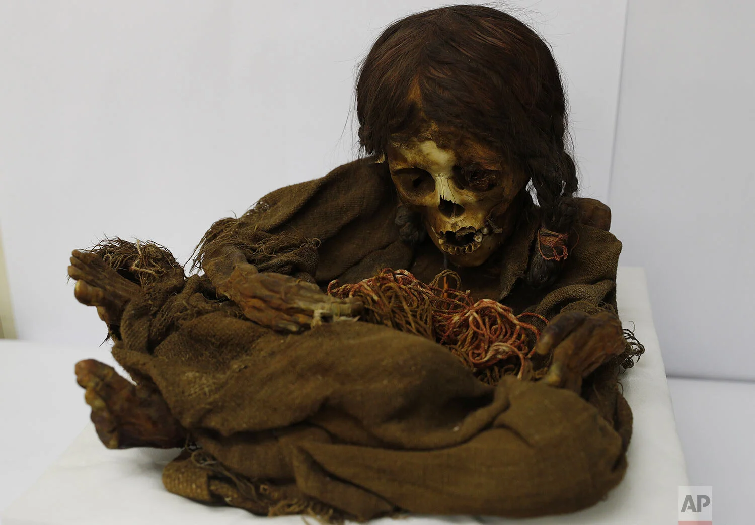 The 500-year-old mummy of an Incan girl sits inside a vault at the National Museum of Archaeology in La Paz, Bolivia, Aug. 15, 2019. Nicknamed Nusta, a Quechua word for “Princess,” the mummy recently returned to its native Bolivia 129 years after it was donated to the Michigan State University museum in 1890. (AP Photo/Juan Karita)