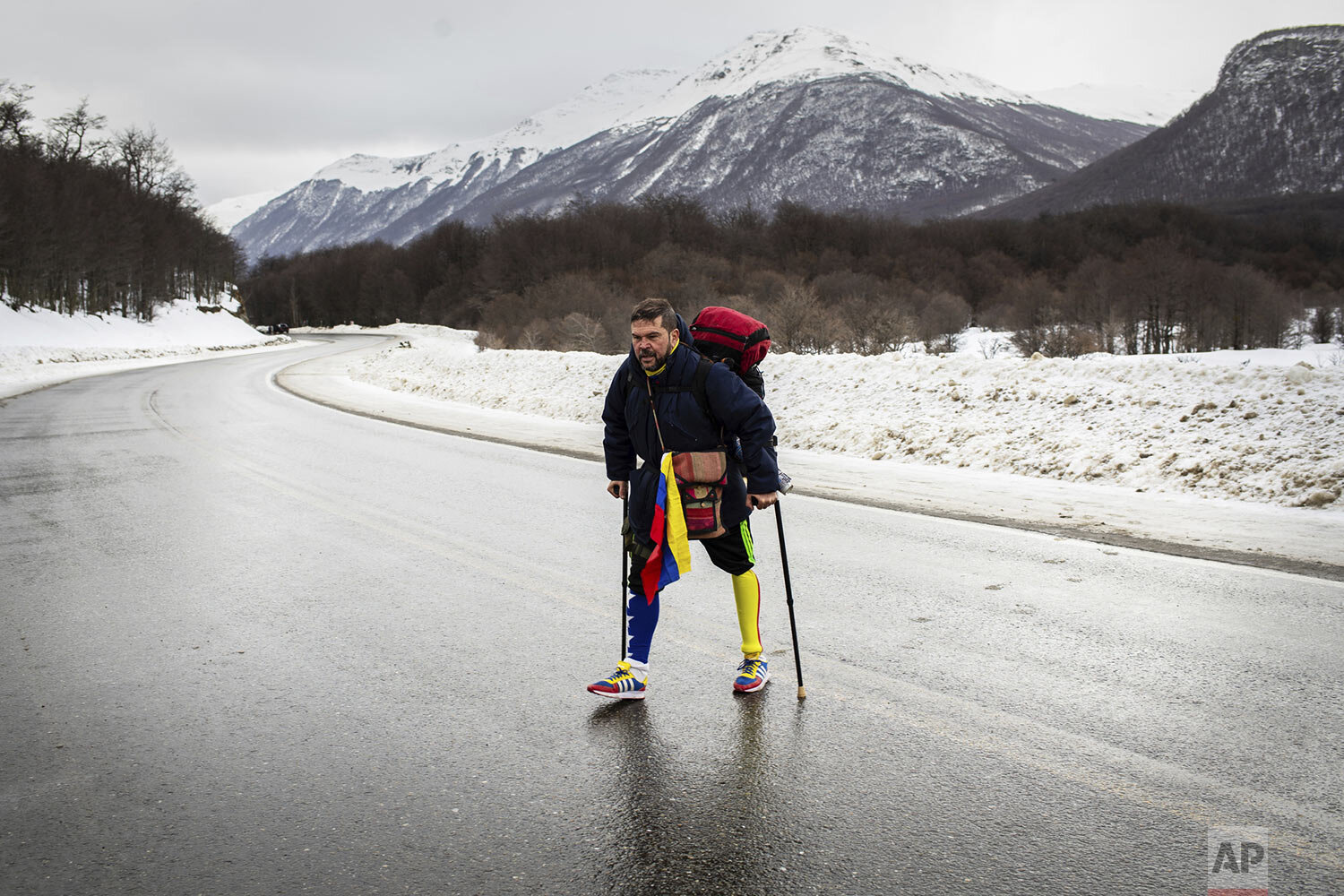  Venezuelan Yeslie Aranda, 57, walks on Route 3 between Tolhuin and Ushuaia, Argentina, Aug. 17, 2019. Aranda left his hometown of San Cristobal in the southeastern state of Táchira last year with a backpack, $30 in his pocket and an aluminum prosthe