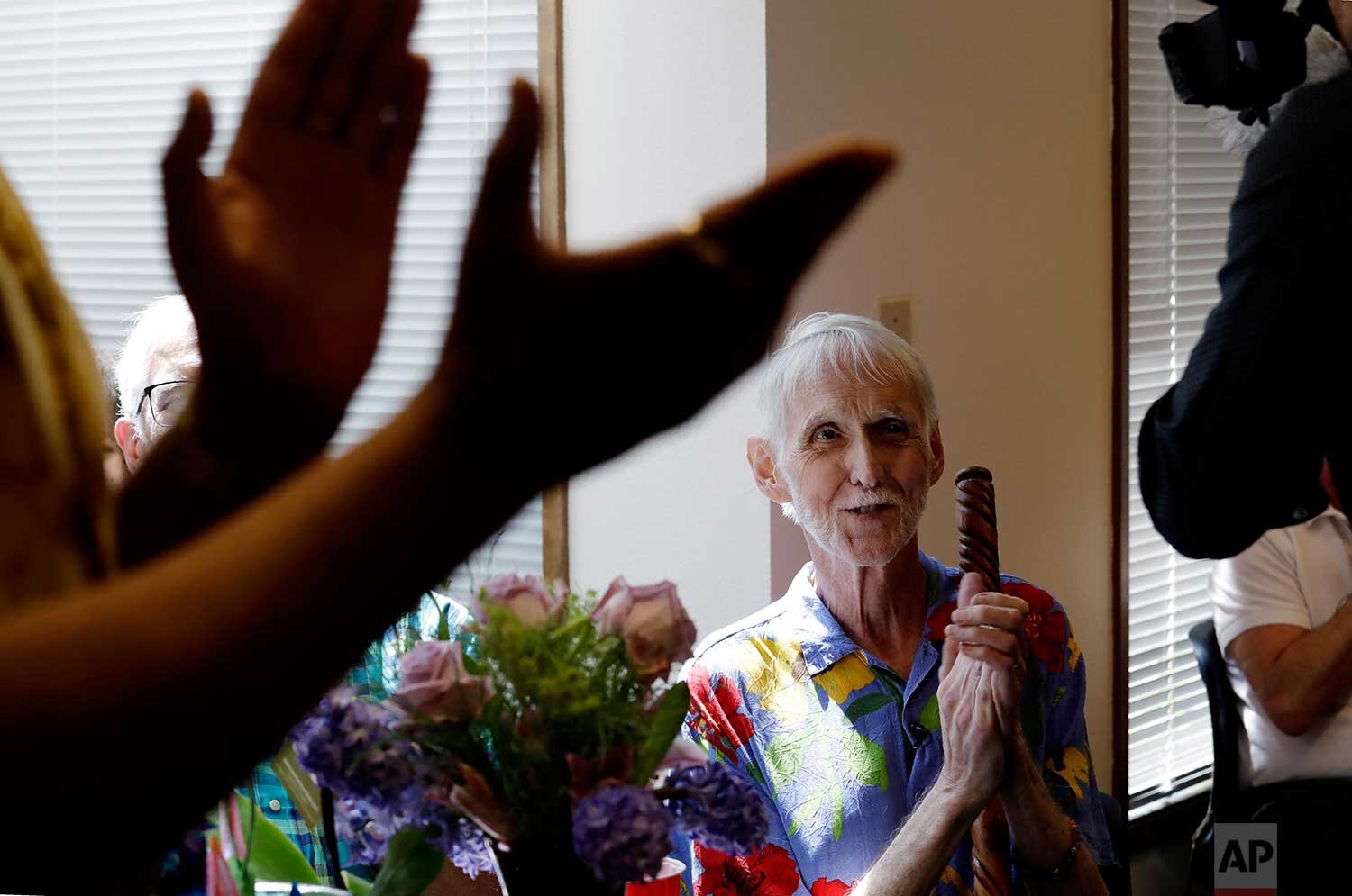  In this May 10, 2019, photo, Robert Fuller smiles as he listens to music at a party in his honor, hours before he would die, in Seattle. (AP Photo/Elaine Thompson) 