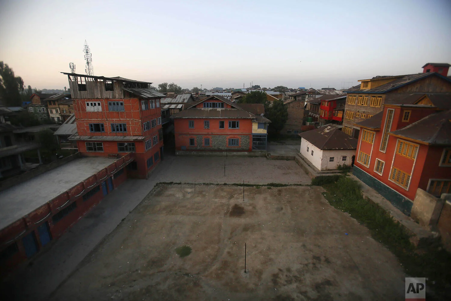 A school building stands isolated during a strike in Srinagar, Indian controlled Kashmir, Thursday, Sept. 12, 2019. (AP Photo/Mukhtar Khan)