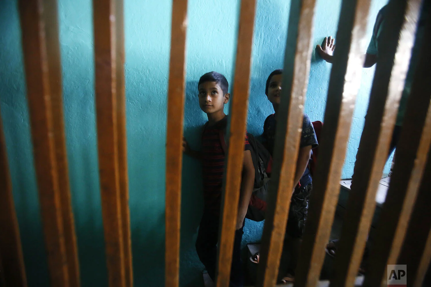 Kashmiri children leave a local mosque as they attend free classes by locals during a strike in Srinagar, Indian controlled Kashmir, Thursday, Sept. 12, 2019. (AP Photo/Mukhtar Khan)