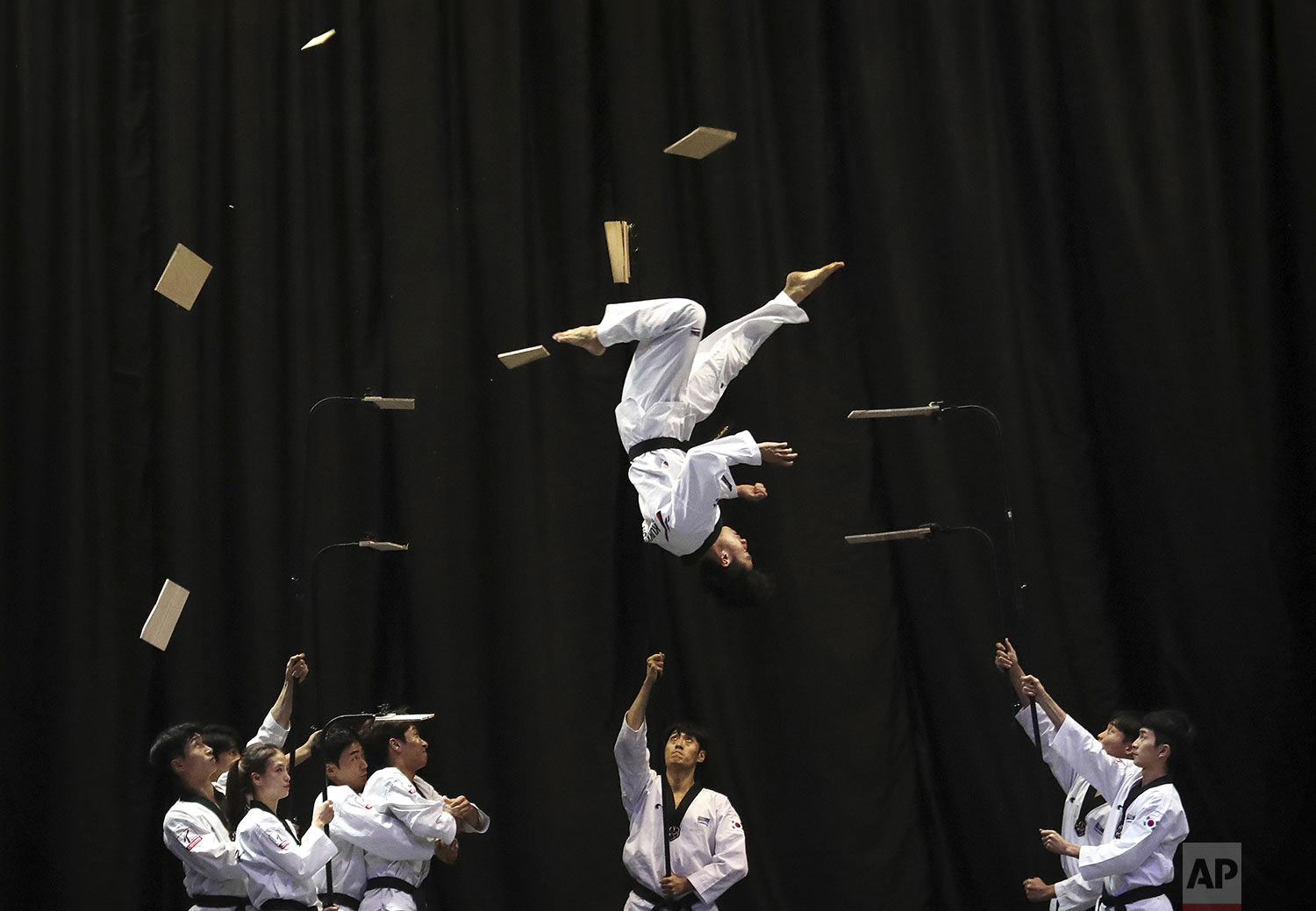  Members of the South Korean Taekwondo demonstration team perform during a visit by Bulgarian Prime Minister Boyko Borisov at Kukkiwon, the headquarters and academy of World Taekwondo, in Seoul, South Korea, Wednesday, Sept. 25, 2019. (AP Photo/Ahn Y