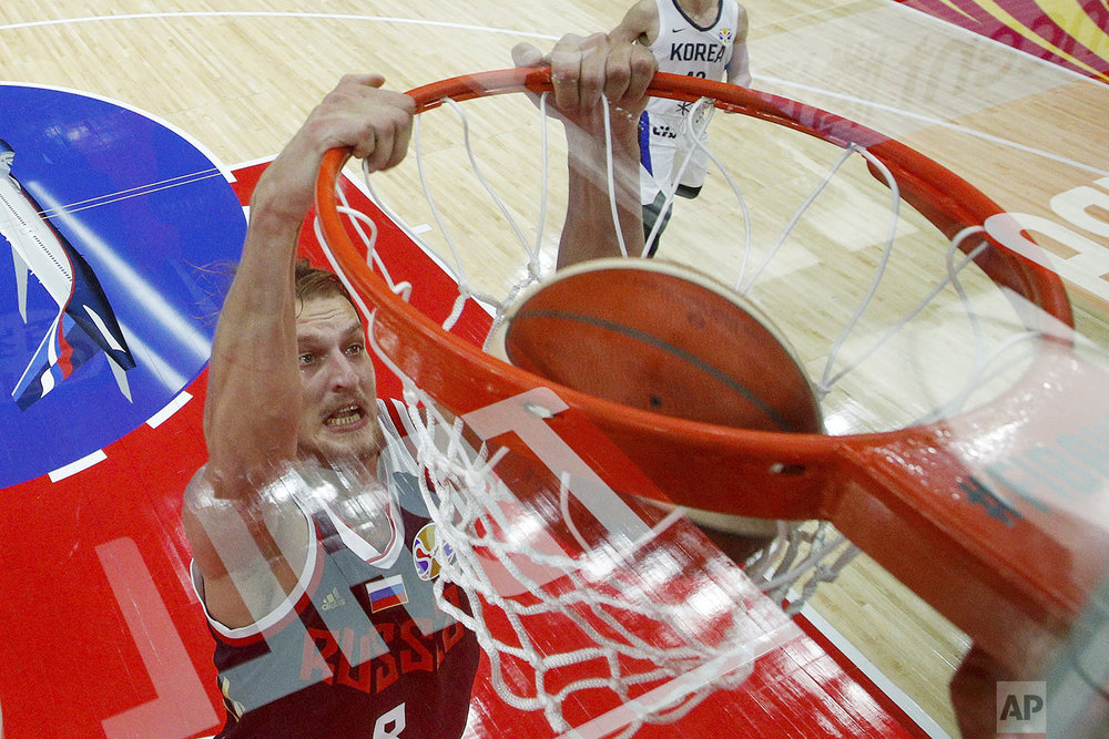  Vladimir Ivlev, of Russia, dunks the ball during the group B game against South Korea in the FIBA Basketball World Cup, at the Sport Center in Wuhan in central China's Hubei province, Monday, Sept. 2, 2019. (AP Photo/Andy Wong) 