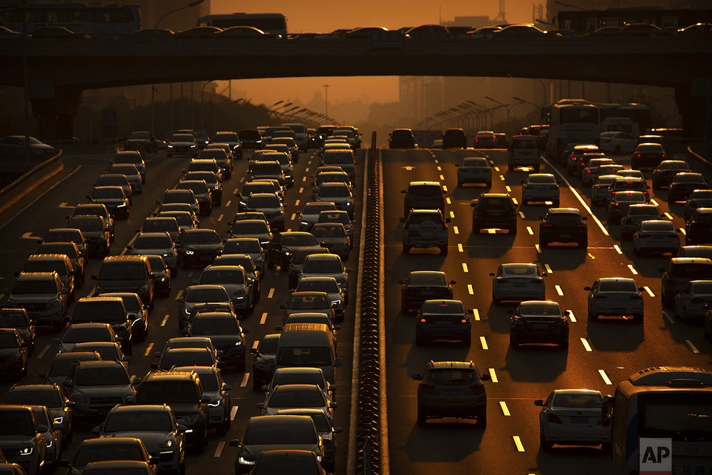  Commuters make their way along an expressway during rush hour in Beijing, Friday, Sept. 6, 2019. (AP Photo/Mark Schiefelbein) 