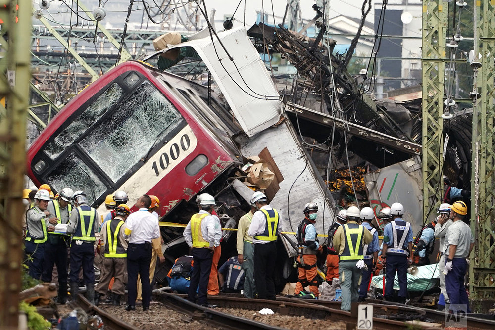  The Keikyu express train sits derailed after its collision with a truck in Yokohama, south of Tokyo Thursday, Sept. 5, 2019. (AP Photo/Eugene Hoshiko) 