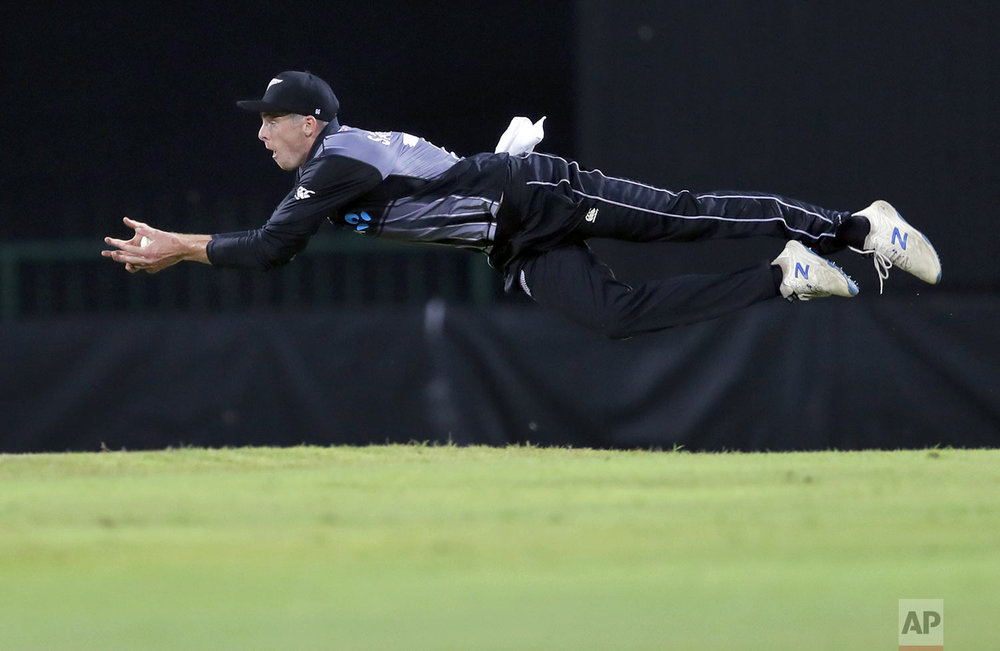 New Zealand's Mitchell Santner successfully takes a catch to dismiss Sri Lanka's Avishka Fernando during the second Twenty20 international cricket match between Sri Lanka and New Zealand in Pallekele, Sri Lanka, Tuesday, Sept. 3, 2019. (AP Photo/Eranga Jayawardena)