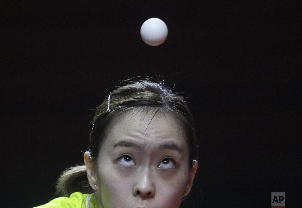 Japan's Kasumi Ishikawa plays against China's Chen Meng during their women's team table tennis final match at the ITTF-ATTU Asian Table Tennis Championships at Amongrogo stadium in Yogyakarta, Central Java, Indonesia, Tuesday, Sept. 17, 2019. (AP Photo/Kalandra)