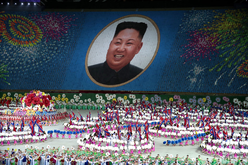  Performers hold up cards to form a portrait of North Korean leader Kim Jong Un during a mass games performance titled "The Land of the People" at May Day Stadium in Pyongyang, North Koreai, Wednesday, Sept. 11, 2019. (AP Photo/Dita Alangkara) 