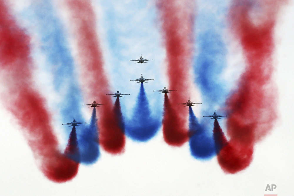 South Korea's Black Eagles acrobatic flight team performs during a media preview of Air Power Day at Osan Air Base in Pyeongtaek, South Korea, Friday, Sept. 20, 2019. (Hong Hae-in/Yonhap via AP)