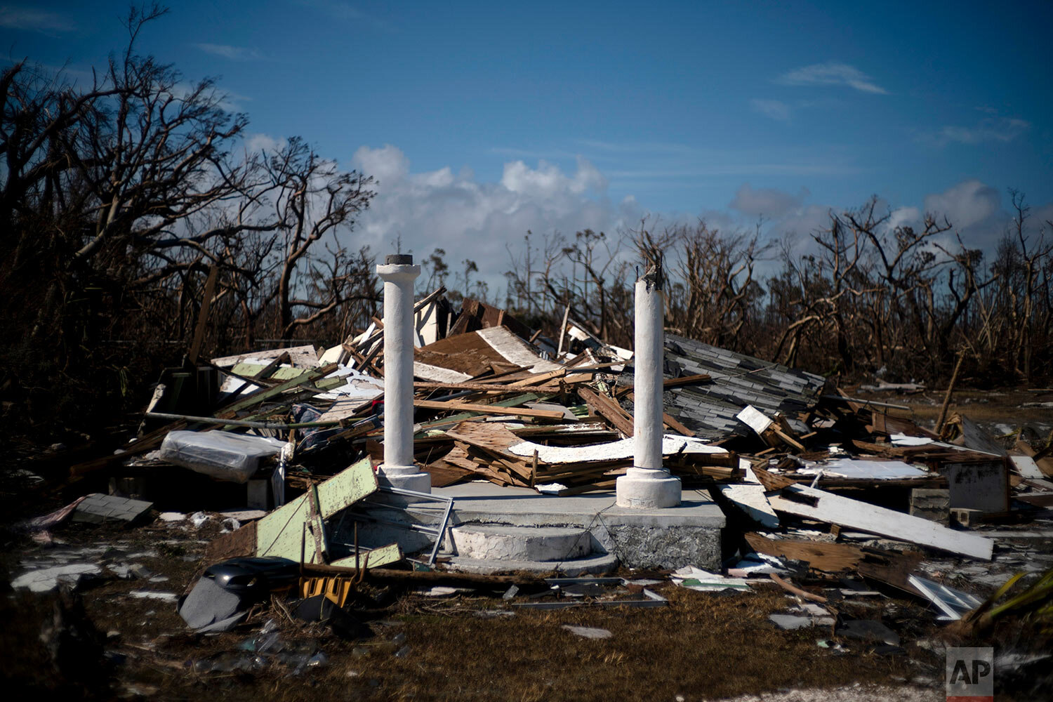 The portico of a house destroyed by Hurricane Dorian is the only thing that stands of the structure, destroyed by Hurricane Dorian, in High Rock, Grand Bahama, Bahamas, Thursday Sept. 5, 2019. (AP Photo/Ramon Espinosa)