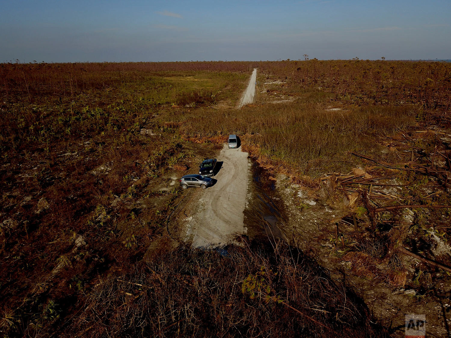  Cars stand stranded on a road damaged by Hurricane Dorian in High Rock, Grand Bahama, Bahamas, Friday Sept. 6, 2019. (AP Photo/Ramon Espinosa) 