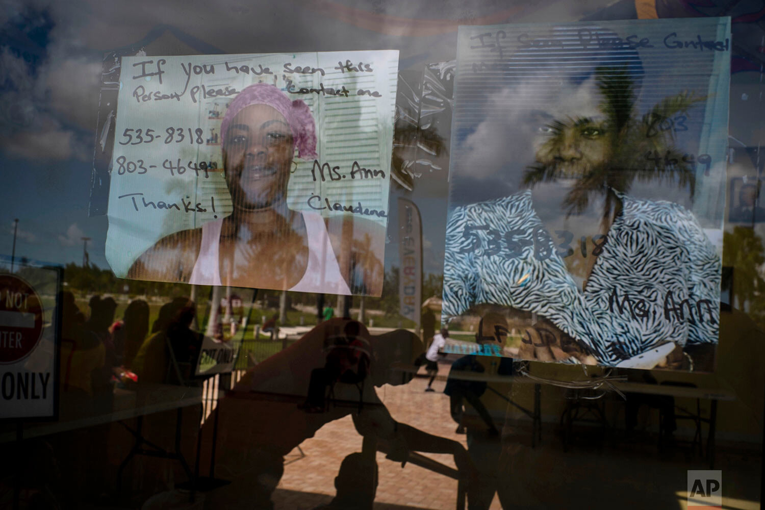  Photos of two women missing during Hurricane Dorian hang from the door of the shelter for displaced people from Abaco because of the destruction by Hurricane Dorian in Nassau, Bahamas, Saturday, Sept. 28, 2019. (AP Photo / Ramon Espinosa) 