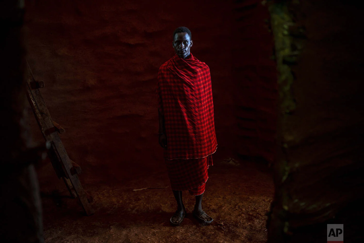 Saitoti Petro poses for a portrait near the village of Narakauwo, Tanzania, Thursday July 4, 2019. (AP Photo/Jerome Delay)