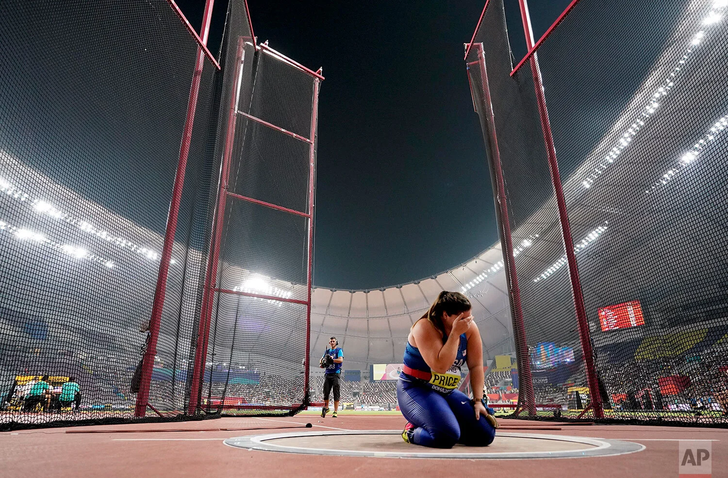 Deanna Price, of the United States, celebrates winning the gold medal for the women's hammer throw at the World Athletics Championships in Doha, Qatar, Saturday, Sept. 28, 2019. (AP Photo/David J. Phillip)
