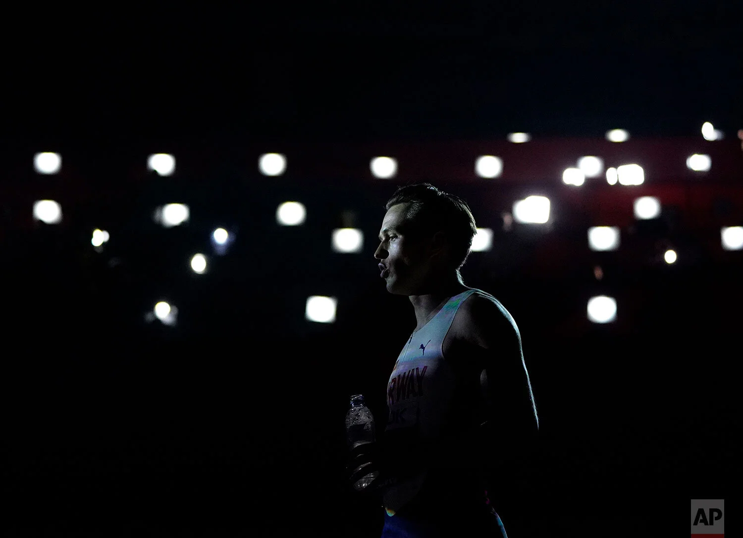Karsten Warholm, of Norway, stands in front of lights at the start of the men's 400 meter hurdles final at the World Athletics Championships in Doha, Qatar, Monday, Sept. 30, 2019. Warholm won the gold medal in the event. (AP Photo/David J. Phillip)
