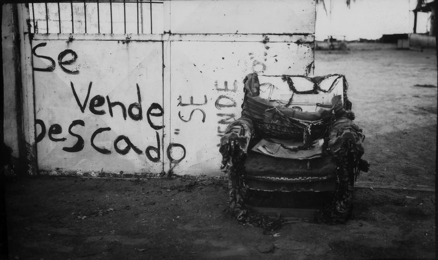 In this July 8 16, 2019 photo, a damaged coach is seen outside a fisherman house in Cabimas, Venezuela. (AP Photo/Rodrigo Abd)