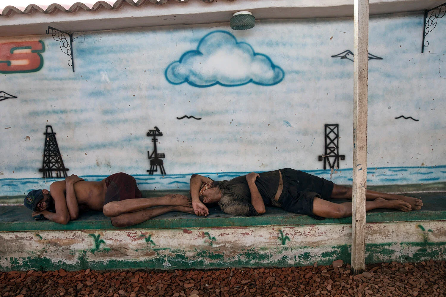 Fishermen nap after working to catch crabs in Lake Maracaibo, Cabimas, Venezuela, early July 11, 2019. (AP Photo/Rodrigo Abd)