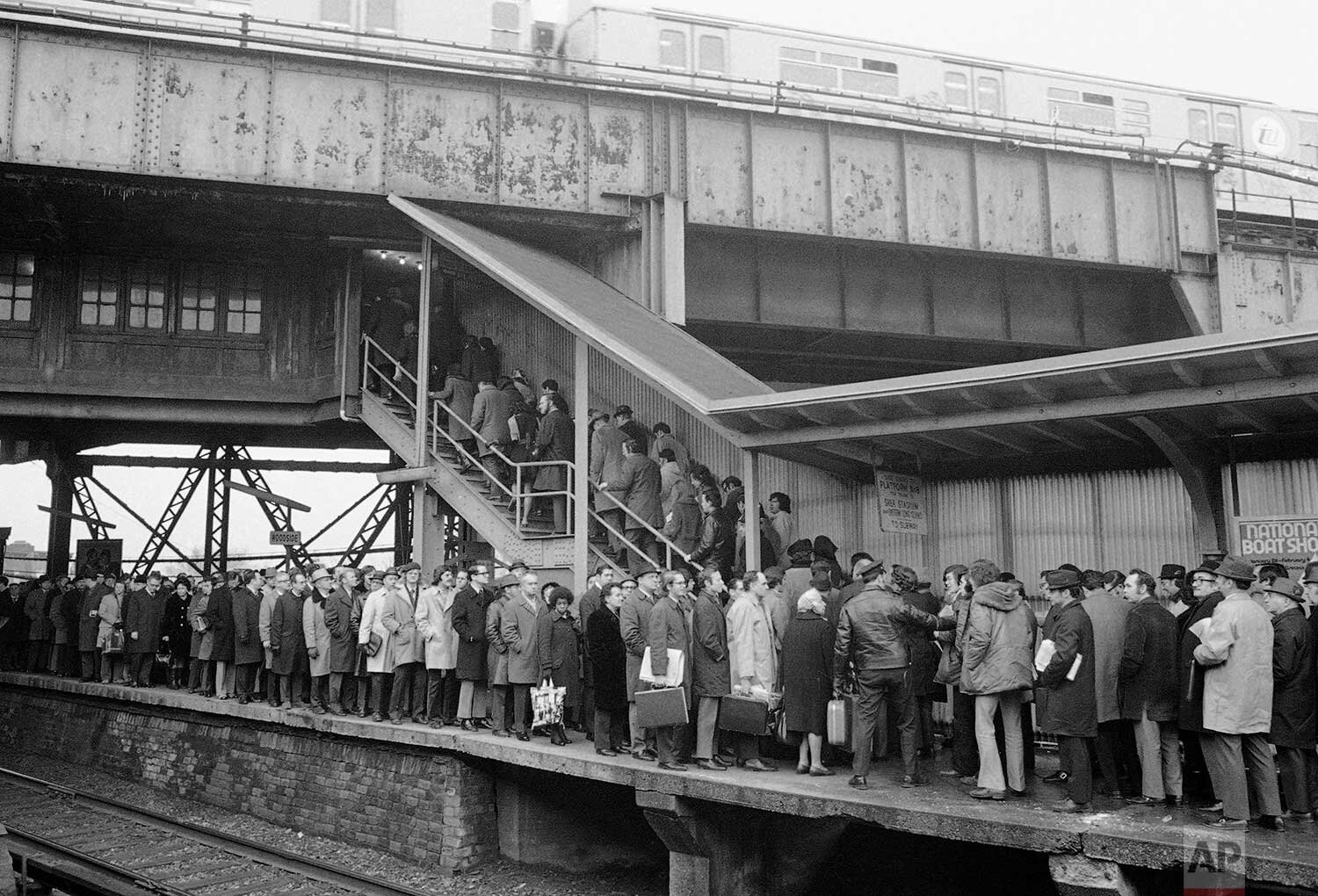  Long Island Railroad commuters get in line to catch subway trains at the Woodside station, Feb. 8, 1973, in the Queens borough of New York.  The Penn Central strike closed LIRR tracks into Penn Station, forcing LIRR commuters to use the subways in Q