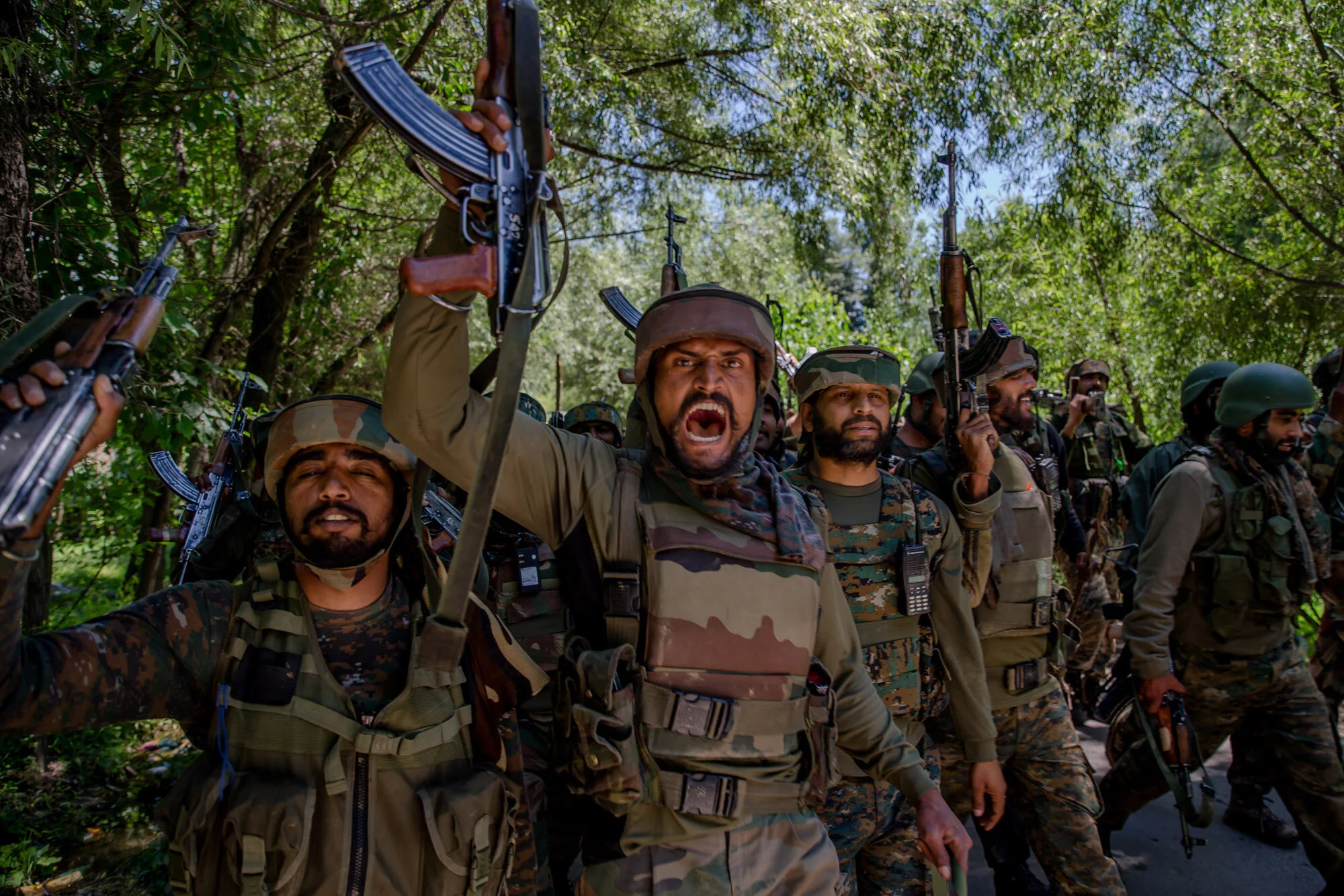 Indian army soldiers shout pro Indian and anti Pakistan slogans as they leave the site of gun-battle in Dialgham about 60 Kilometres South Srinagar, Indian controlled Kashmir, July 1, 2017. (AP Photo/Dar Yasin)