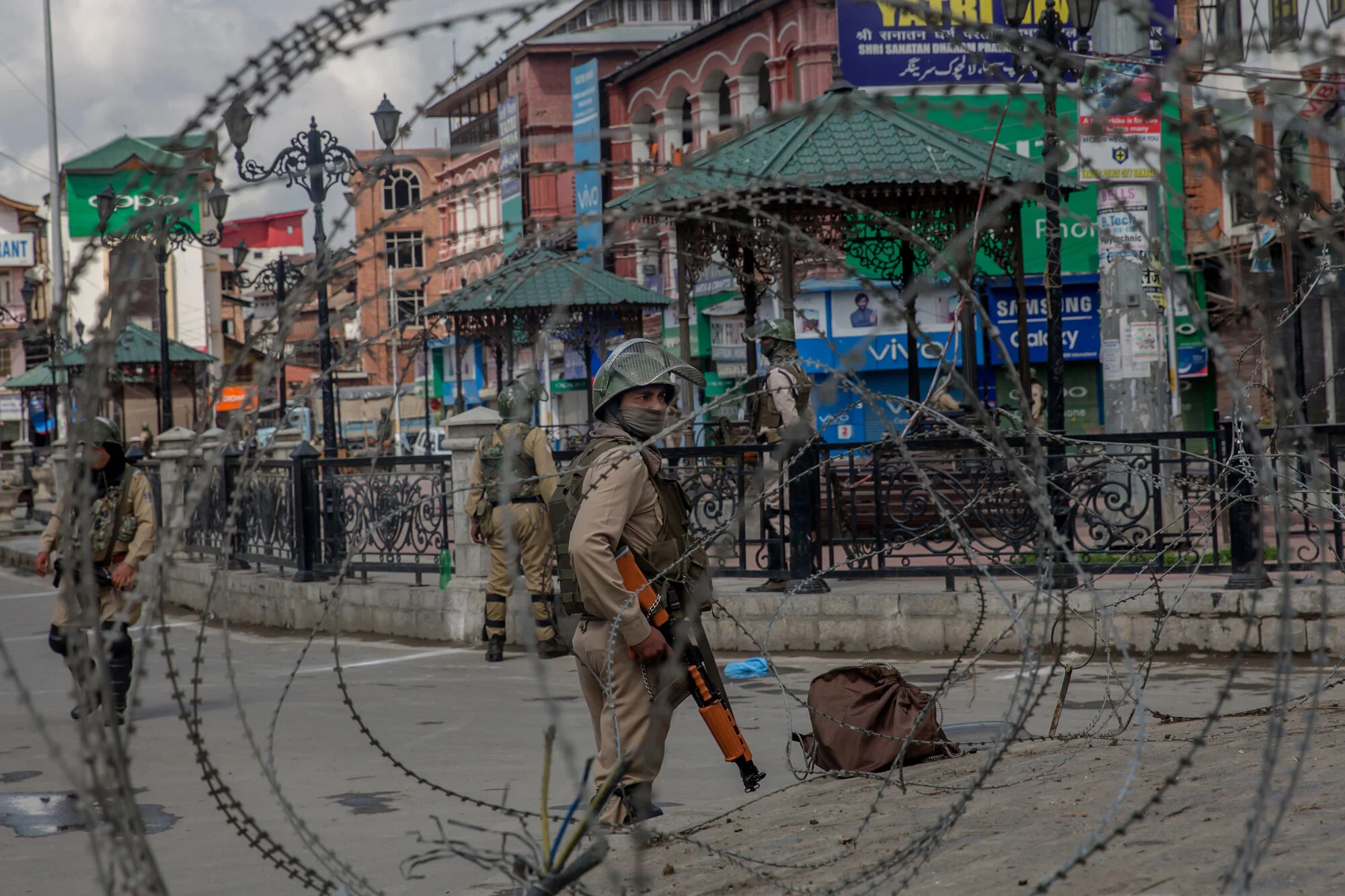 Indian Paramilitary soldiers are seen through barbed wire during strike in Srinagar, Indian controlled Kashmir, Saturday, May 19, 2018. (AP Photo/Dar Yasin)