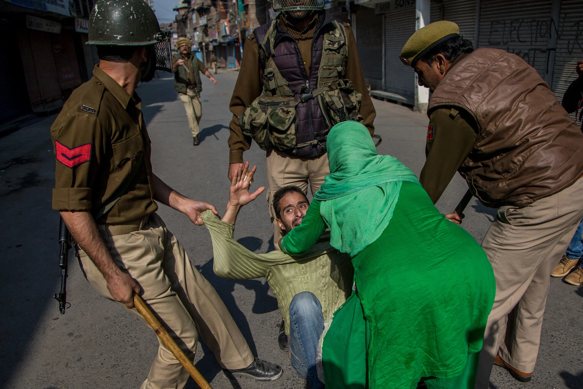 Indian police men try to detain Kashmiri man during a protest in Srinagar, Indian controlled Kashmir, Oct. 22, 2016. (AP Photo/Dar Yasin)