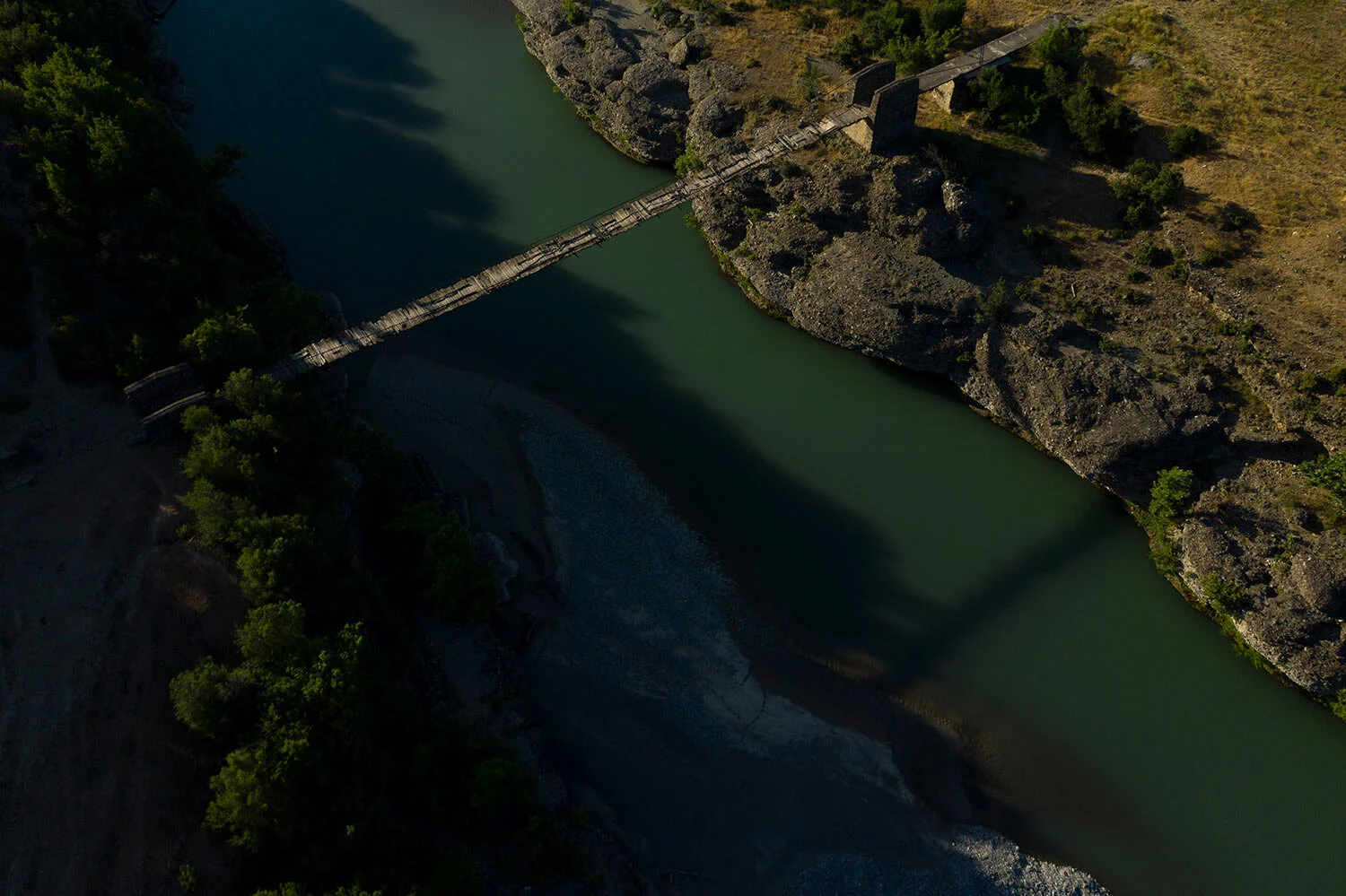 An old bridge spans the Vjosa River near the border with Greece, in Albania. (AP Photo/Felipe Dana)