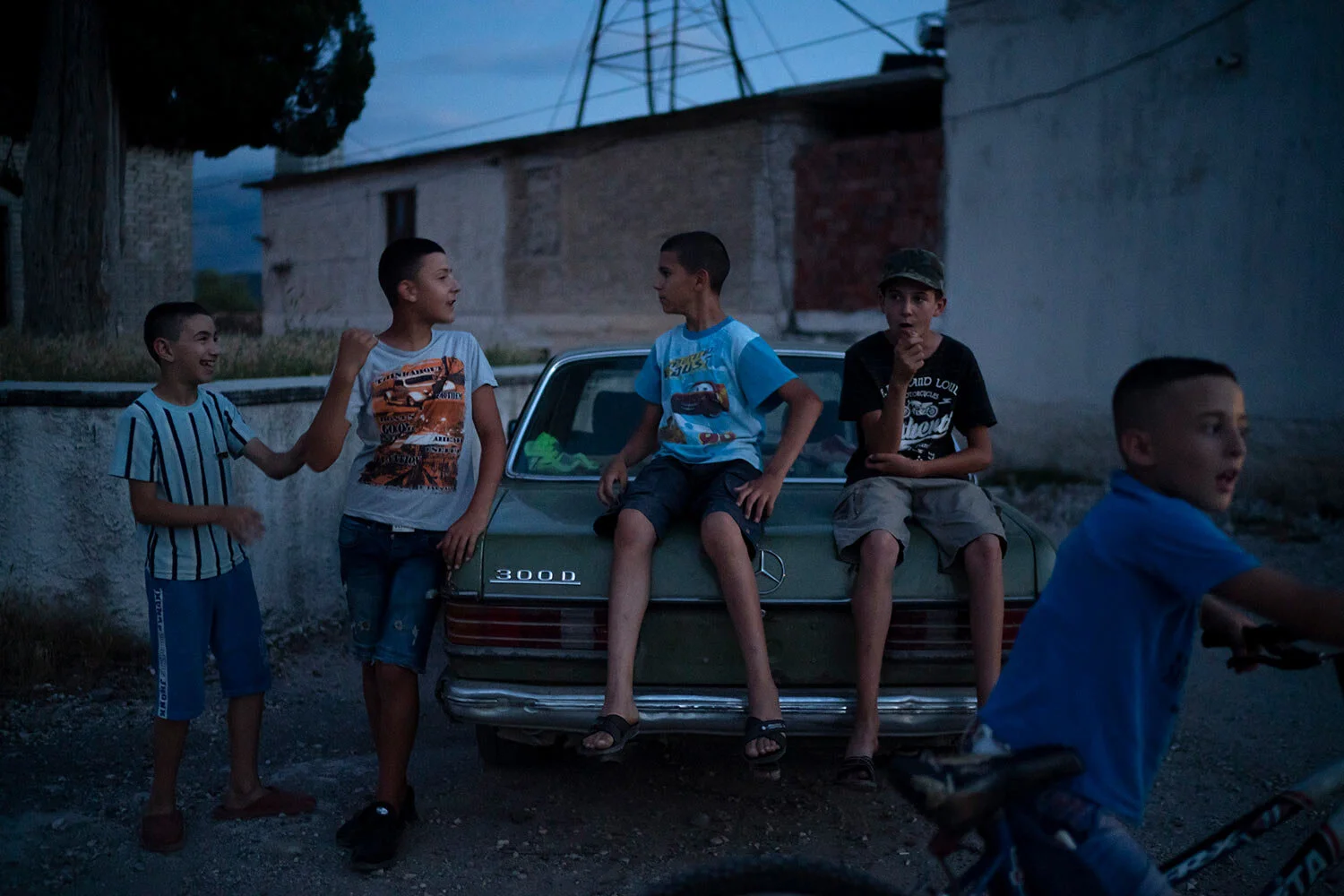 Children play outside at dusk in the village of Kute, Albania. (AP Photo/Felipe Dana)