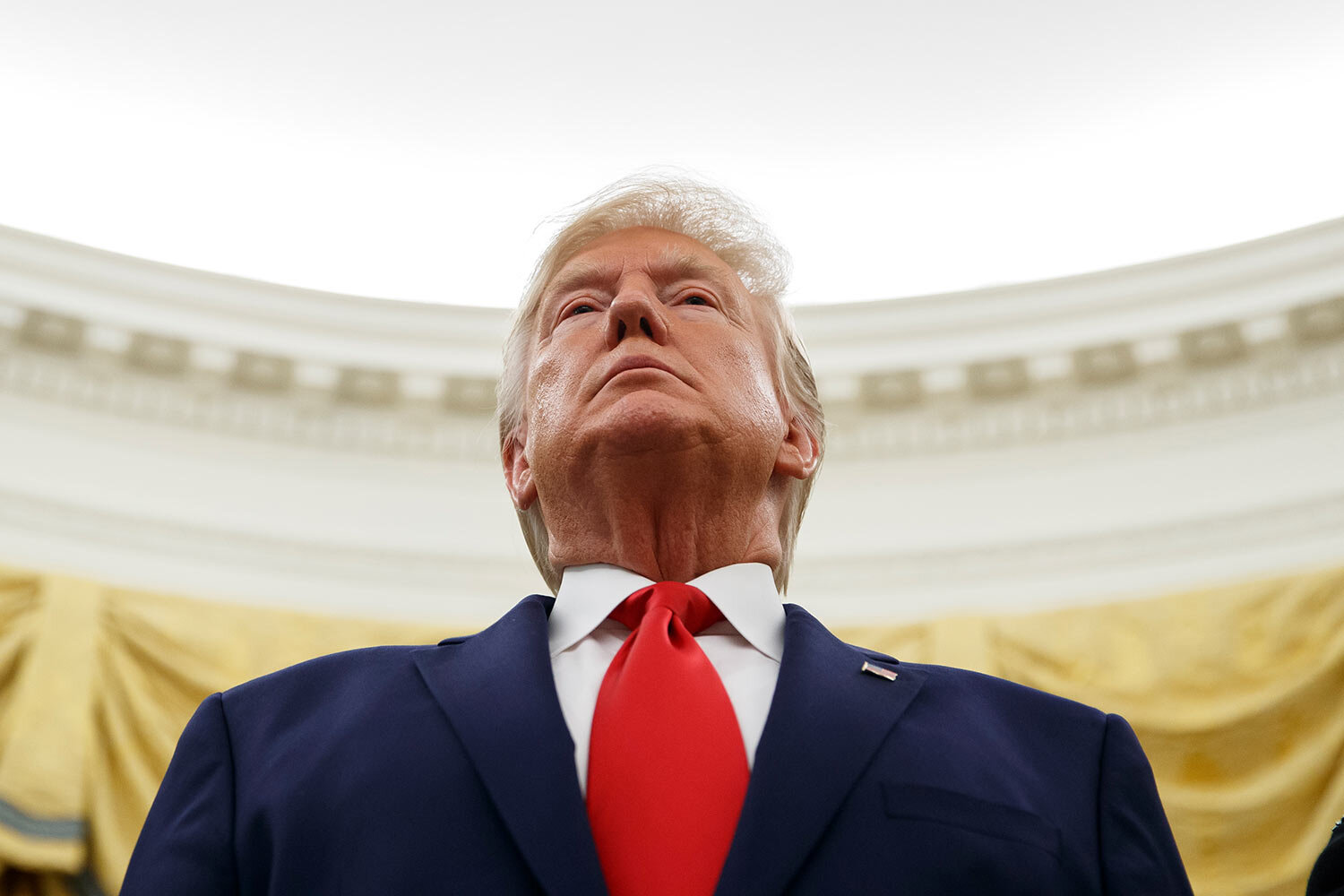 President Donald Trump stands during a Presidential Medal of Freedom ceremony for auto racing great Roger Penske in the Oval Office of the White House, Thursday, Oct. 24, 2019, in Washington. (AP Photo/Alex Brandon)