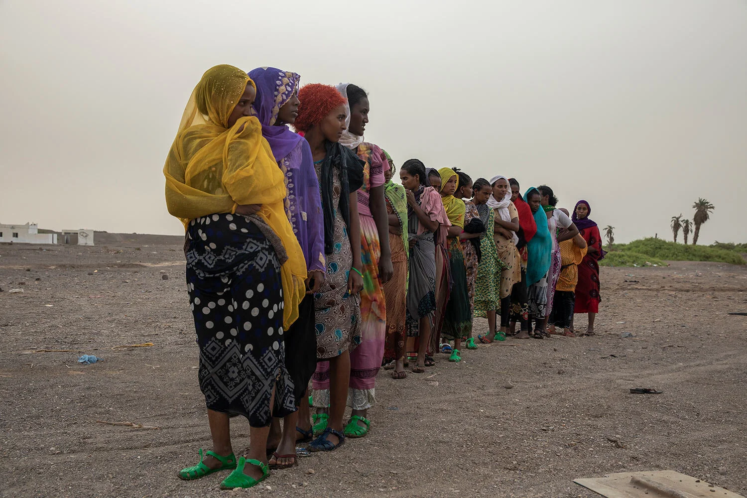 Ethiopian Tigray migrants stand in line to be counted by smugglers in Lahj, Yemen after arriving to the coastal village of Ras al-Ara from Djibouti. (AP Photo/Nariman El-Mofty)