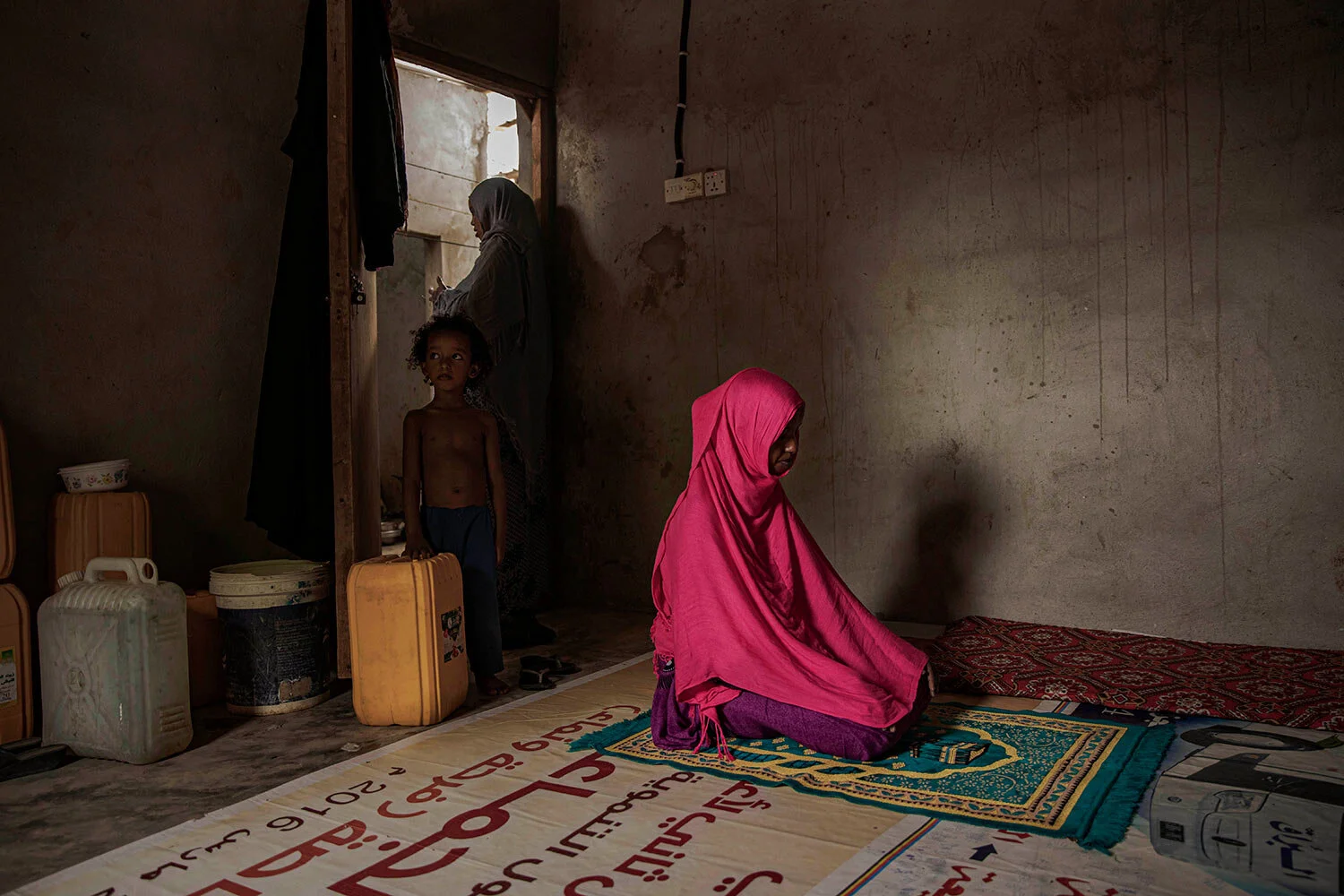 A 17-year-old Ethiopian migrant, a victim of rape, prays in Basateen, a district of Aden, Yemen. She says she had been raped more times than she can count. (AP Photo/Nariman El-Mofty)