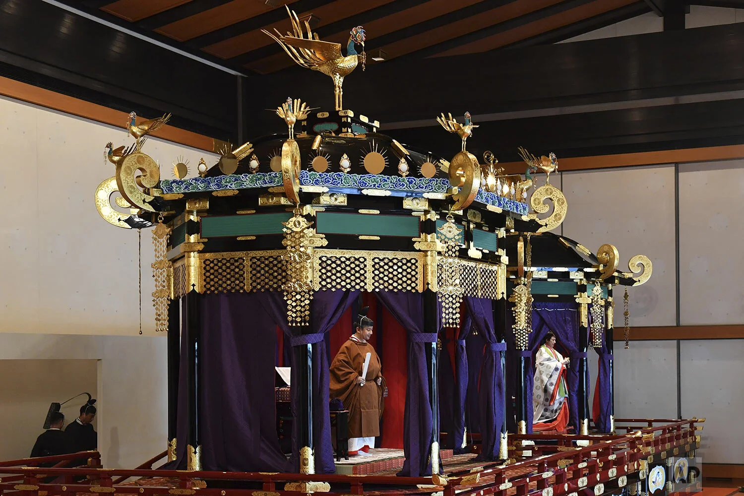 Japan's Emperor Naruhito, left, and Empress Masako attend the enthronement ceremony where emperor officially proclaims his ascension to the Chrysanthemum Throne at the Imperial Palace in Tokyo, Tuesday, Oct. 22, 2019. (Kazuhiro Nogi/Pool Photo via AP)