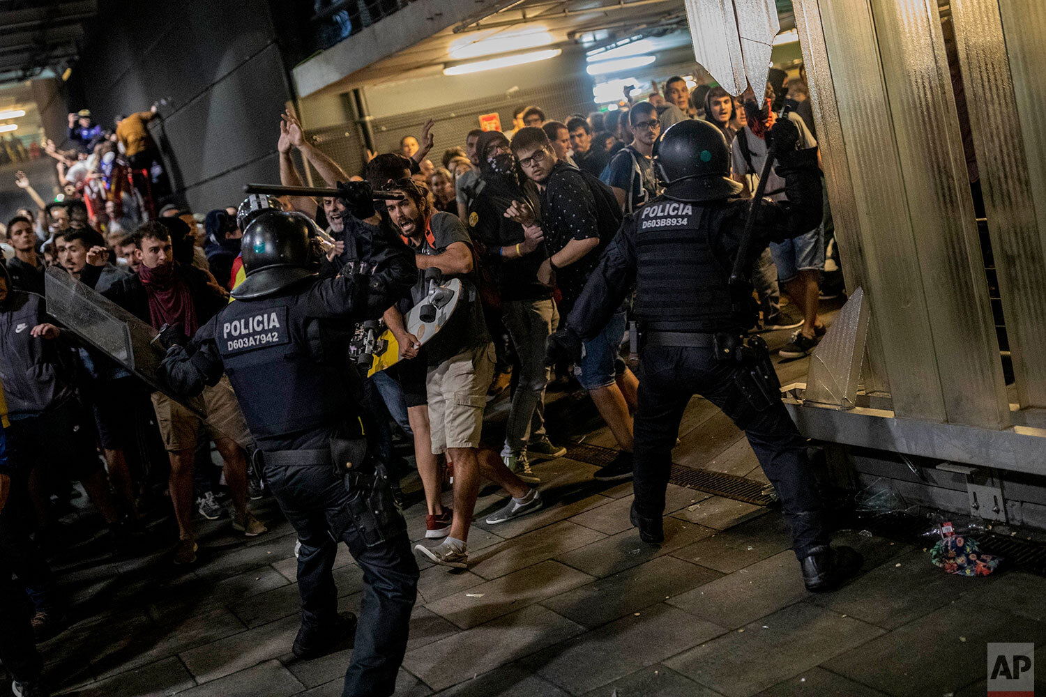  Police clash with protesters during a demonstration at El Prat airport, outskirts of Barcelona, Spain, Monday, Oct. 14, 2019. Spain's Supreme Court on Monday sentenced 12 prominent former Catalan politicians and activists to lengthly prison terms fo