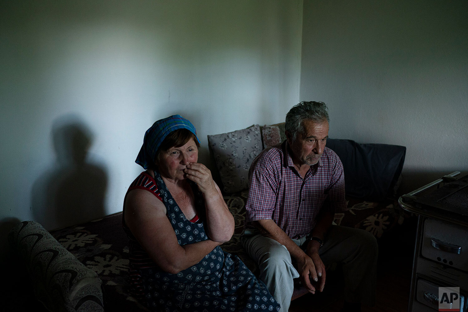  In this June 19, 2019 photo, Jorgji Ilia, 71, a retired schoolteacher, sits with his wife, Vito, 64, inside their home in the village of Kanikol, Albania. "There is nothing else better than the river," he says. "The Vjosa gives beauty to our village