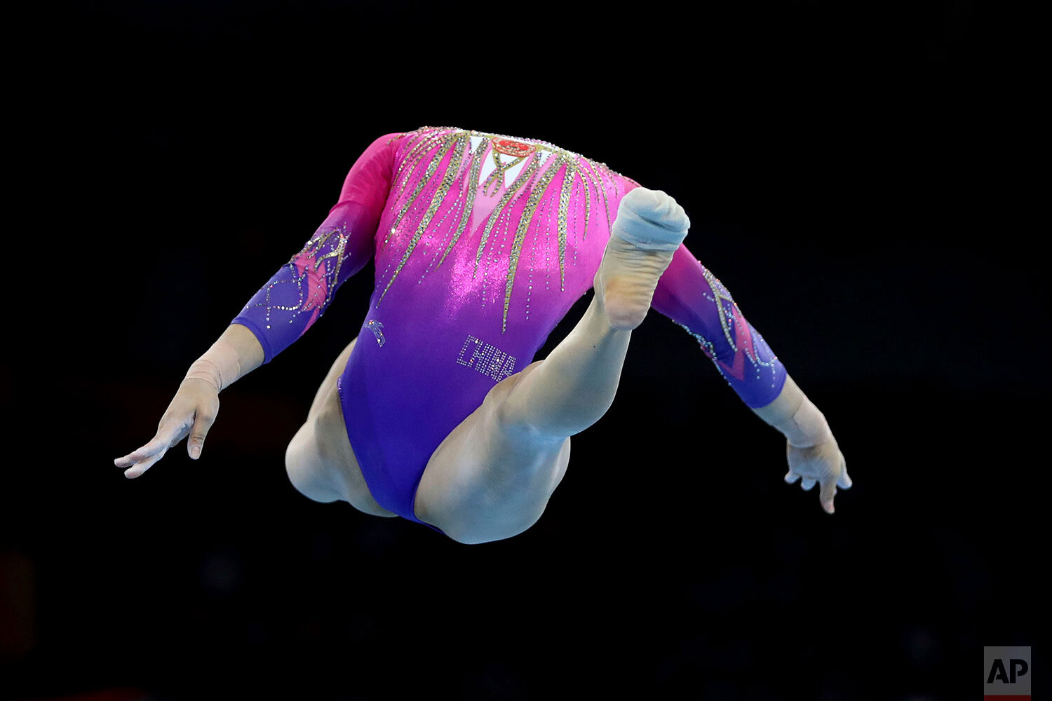  Xijing Tang of China performs on the floor during the women's all-around final at the Gymnastics World Championships in Stuttgart, Germany, Thursday, Oct. 10, 2019. (AP Photo/Matthias Schrader) 