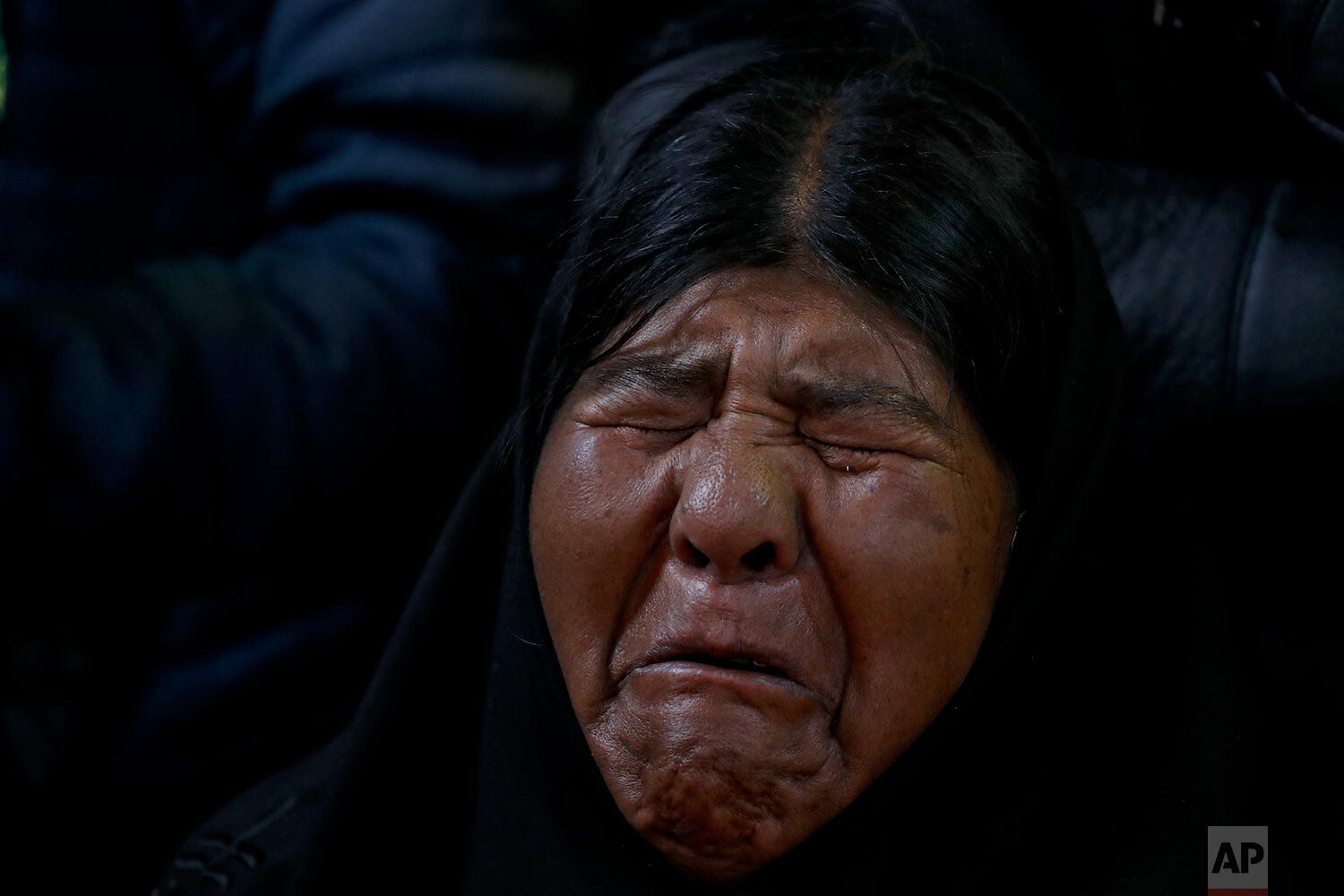  Virginia Ticona mourns during the funeral of her son, Antonio Quispe in El Alto, outskirts of La Paz, Bolivia, Wednesday, Nov. 20, 2019. Quispe was killed on Tuesday when security forces escorting gasoline tankers from a fuel plant clashed with supp