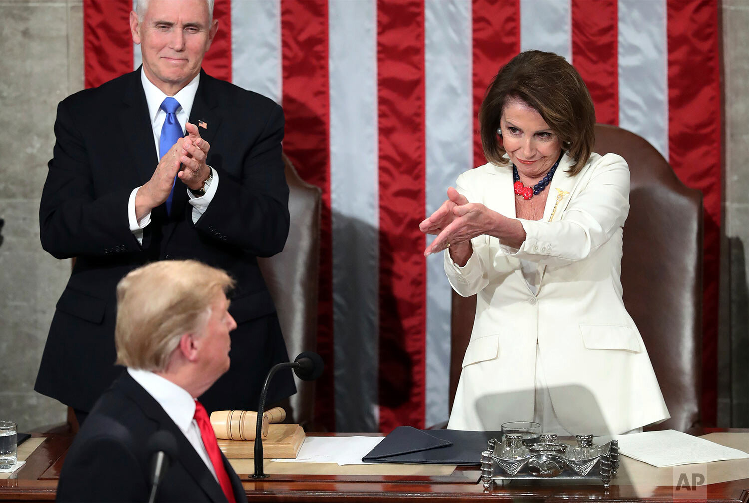  President Donald Trump turns to House Speaker Nancy Pelosi of Calif., as he delivers his State of the Union address to a joint session of Congress on Capitol Hill in Washington, as Vice President Mike Pence watches, on Feb. 5, 2019. (AP Photo/Andrew