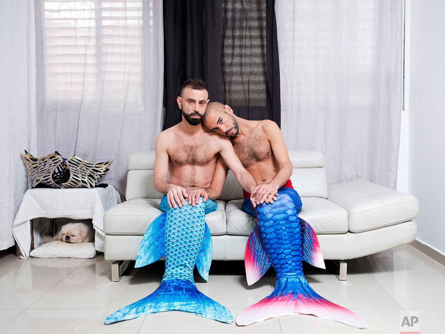  Adi Kazav, left, and Lied Adi Hagbi, members of the Israeli Mermaid Community, pose for a portrait wearing mermaid tails at their home in Netanya, Israel, on Feb. 21, 2019. (AP Photo/Oded Balilty) 