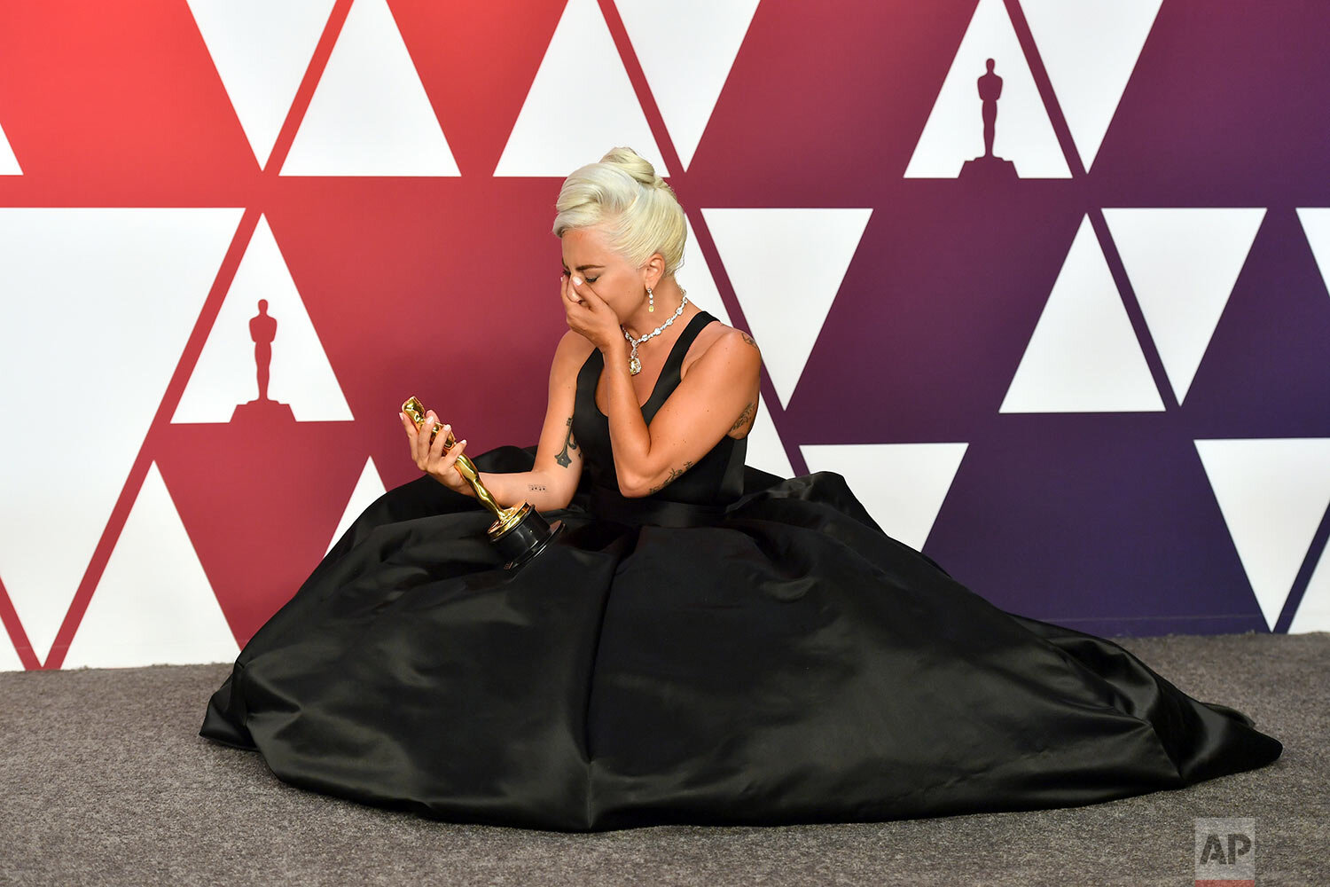  Lady Gaga, winner of the Academy Award for best original song for "Shallow" from "A Star Is Born," gets emotional in the press room during the Oscars at the Dolby Theatre in Los Angeles on Feb. 24, 2019. (Photo by Jordan Strauss/Invision/AP) 