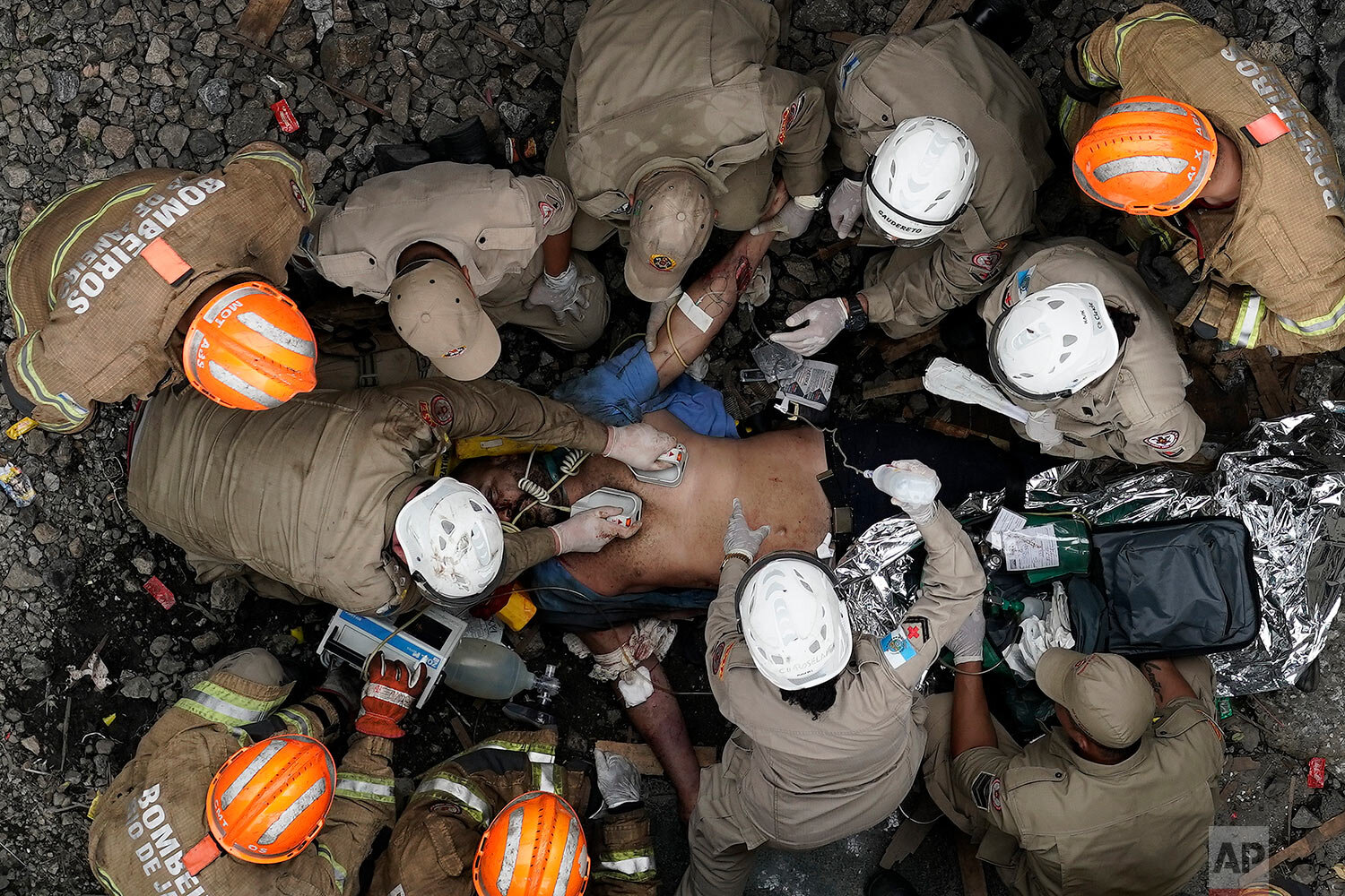  Firefighters work to resuscitate the driver of a commuter train who was injured in a collision with another train in Sao Cristovao station in Rio de Janeiro, Brazil, on Feb. 27, 2019. (AP Photo/Leo Correa) 